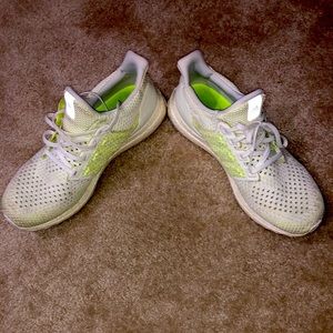 Size 11.5 Adidas ultra-boost tennis shoes.  White with glow in the dark design.